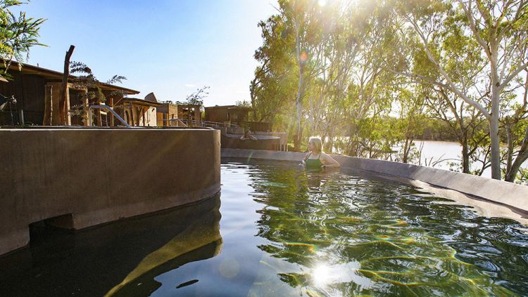 A woman relaxing in the natural hots springs at Cunnamulla Tourist Park